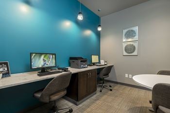 Clubhouse with executive business center, gathering space, and game room with billiards